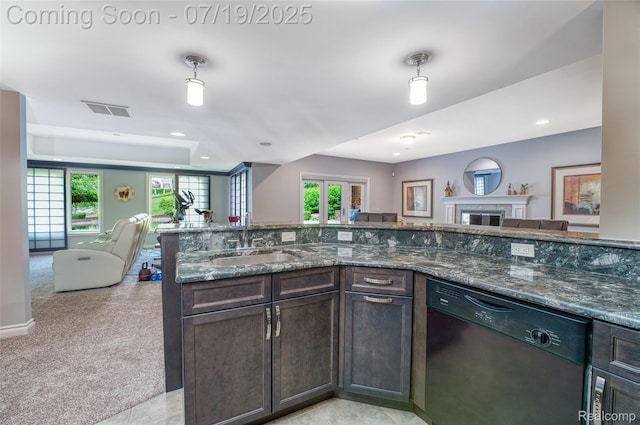 10827 Sparkling Waters Ct, South Lyon, MI 48178 - kitchen with open floor plan, dishwasher, dark brown cabinetry, dark stone counters, and healthy amount of natural light