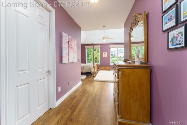 10827 Sparkling Waters Ct, South Lyon, MI 48178 - hall featuring wood finished floors and baseboards