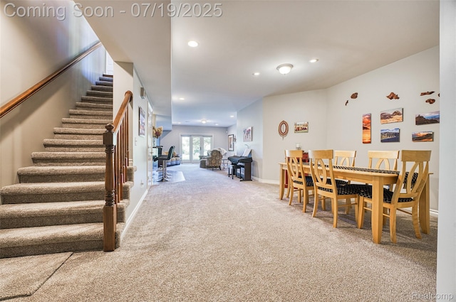 10827 Sparkling Waters Ct, South Lyon, MI 48178 - carpeted dining room featuring stairway and recessed lighting