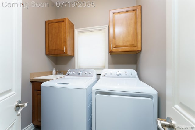 10827 Sparkling Waters Ct, South Lyon, MI 48178 - laundry room with independent washer and dryer and cabinet space