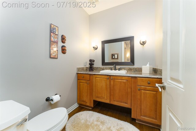 10827 Sparkling Waters Ct, South Lyon, MI 48178 - half bathroom with wood finished floors and vanity