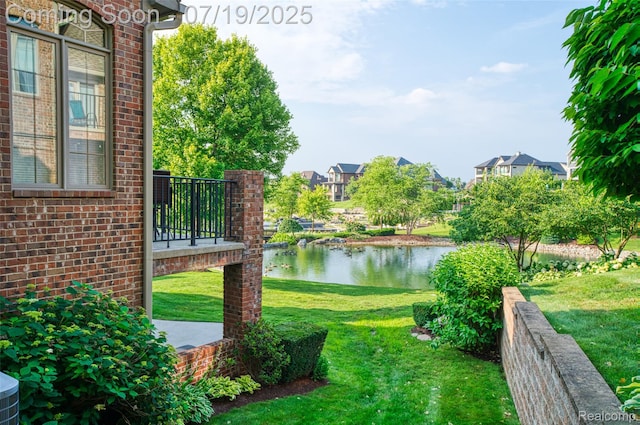 10827 Sparkling Waters Ct, South Lyon, MI 48178 - view of green lawn with a water view