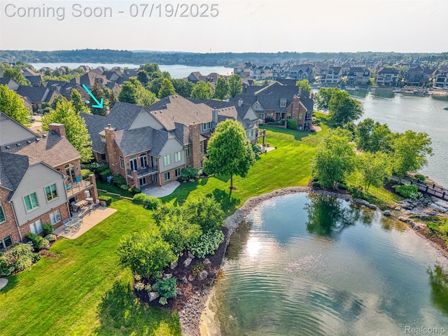 10827 Sparkling Waters Ct, South Lyon, MI 48178 - aerial perspective of suburban area featuring a large body of water