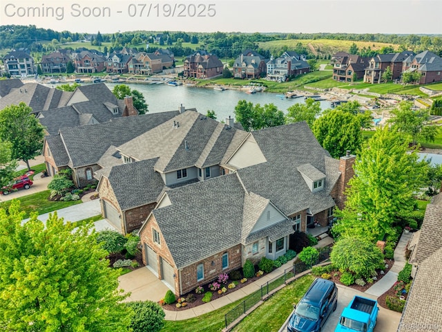 10827 Sparkling Waters Ct, South Lyon, MI 48178 - aerial perspective of suburban area featuring a nearby body of water