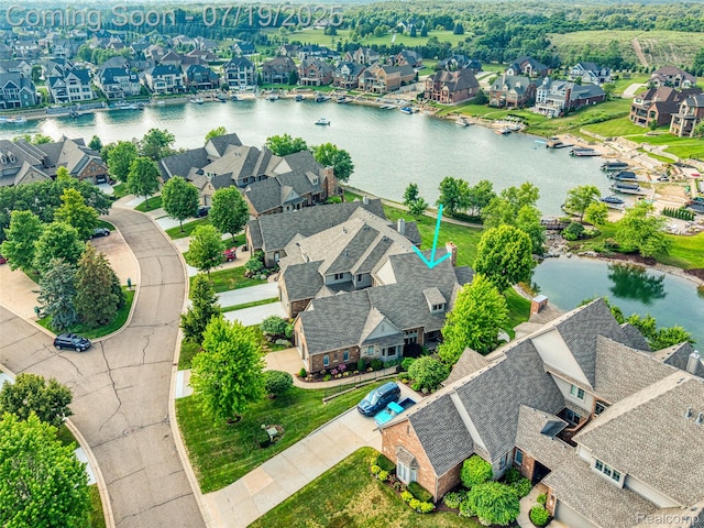 10827 Sparkling Waters Ct, South Lyon, MI 48178 - aerial perspective of suburban area with a nearby body of water