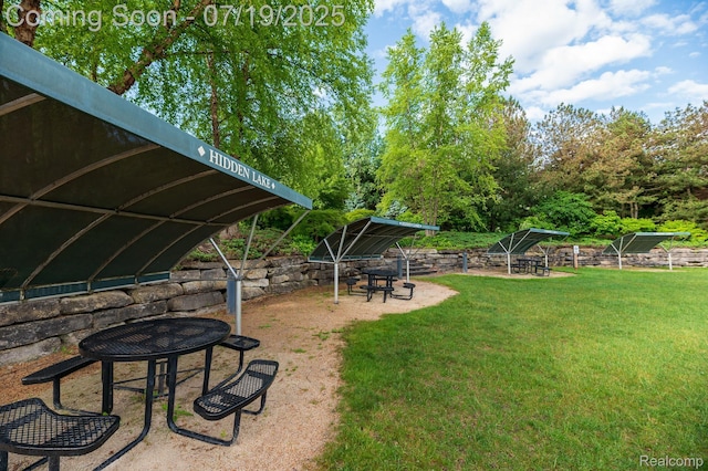 10827 Sparkling Waters Ct, South Lyon, MI 48178 - view of grassy yard with a fire pit