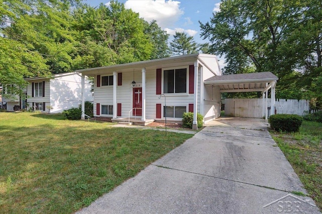 3118 Spruce St, Midland, MI 48640 - split foyer home with concrete driveway and a carport