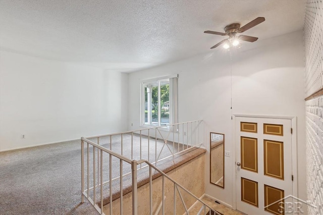 3118 Spruce St, Midland, MI 48640 - stairs with a ceiling fan, carpet flooring, and a textured ceiling