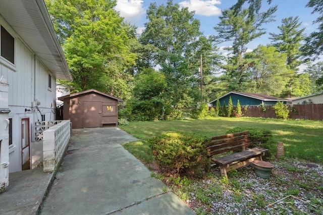 3118 Spruce St, Midland, MI 48640 - view of yard with a storage unit, a patio, and view of scattered trees