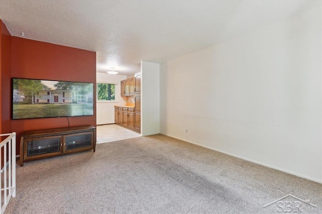 3118 Spruce St, Midland, MI 48640 - unfurnished living room with light colored carpet and a textured ceiling