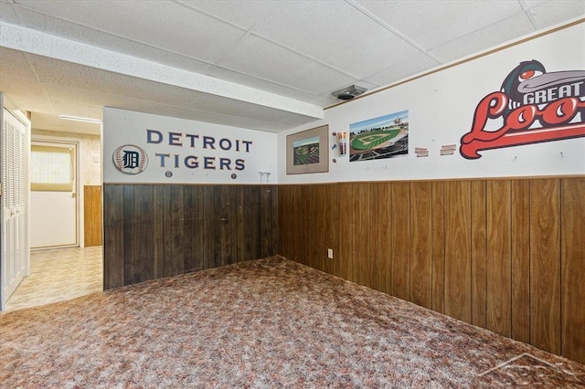 3118 Spruce St, Midland, MI 48640 - hall featuring wooden walls, a paneled ceiling, and a wainscoted wall