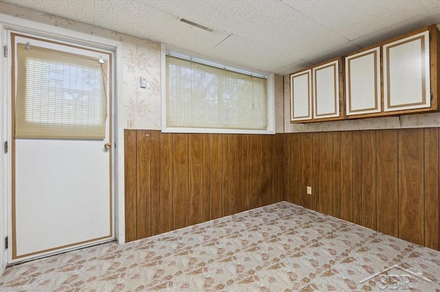 3118 Spruce St, Midland, MI 48640 - empty room featuring wooden walls and wainscoting