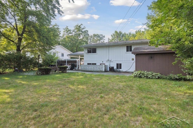 3118 Spruce St, Midland, MI 48640 - rear view of house featuring a yard