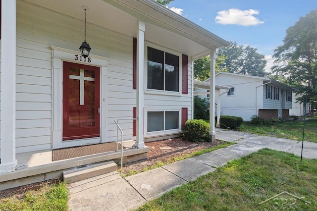 3118 Spruce St, Midland, MI 48640 - property entrance featuring covered porch