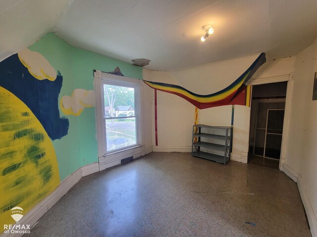 725 River St, Owosso, MI 48867 - bonus room featuring lofted ceiling and baseboards