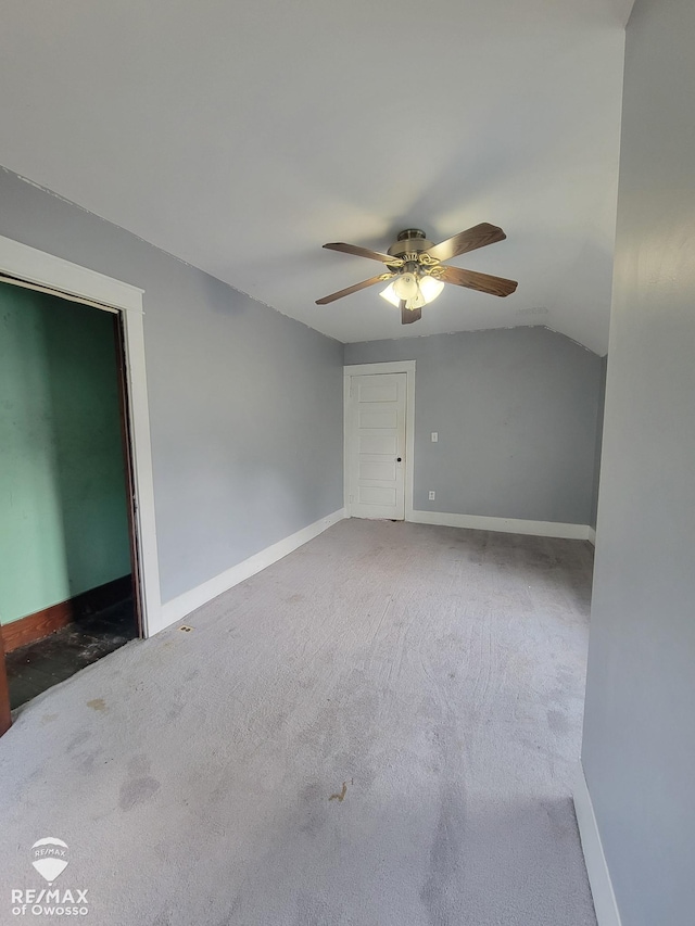 725 River St, Owosso, MI 48867 - bonus room featuring a ceiling fan, vaulted ceiling, and carpet