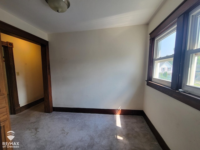 725 River St, Owosso, MI 48867 - unfurnished room with carpet floors and baseboards