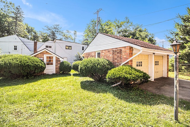 2551 Elmwood Ave, Ann Arbor, MI 48104 - view of home's exterior with an outbuilding and a garage