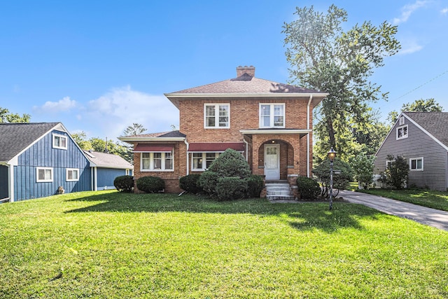2551 Elmwood Ave, Ann Arbor, MI 48104 - view of front facade featuring brick siding, a front lawn, and a chimney