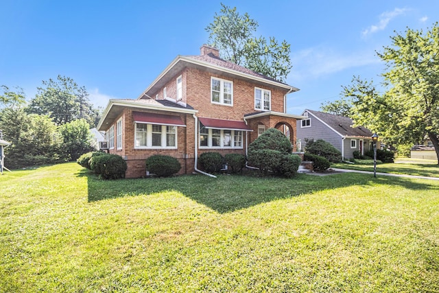 2551 Elmwood Ave, Ann Arbor, MI 48104 - back of property with brick siding, a yard, and a chimney
