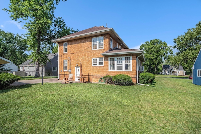 2551 Elmwood Ave, Ann Arbor, MI 48104 - back of property featuring brick siding and a patio