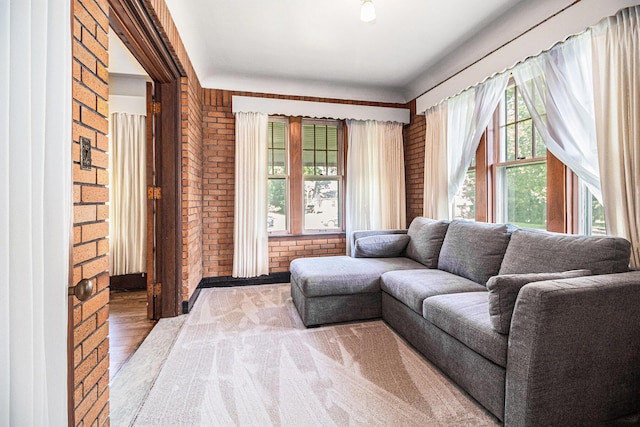 2551 Elmwood Ave, Ann Arbor, MI 48104 - living area featuring brick wall and wood finished floors