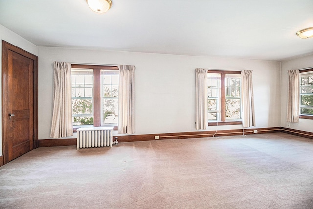 2551 Elmwood Ave, Ann Arbor, MI 48104 - carpeted spare room featuring radiator and baseboards