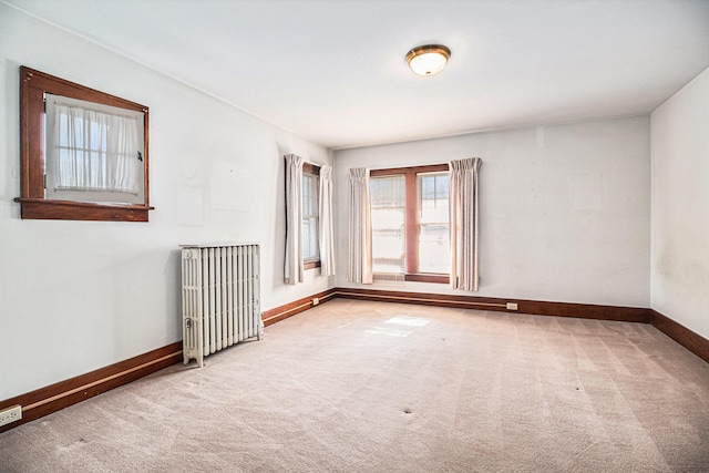 2551 Elmwood Ave, Ann Arbor, MI 48104 - carpeted empty room with radiator heating unit and baseboards