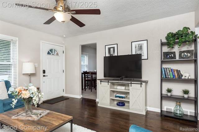 2404 Rowland Ave, Royal Oak, MI 48067 - living room with dark wood-style flooring, plenty of natural light, a ceiling fan, and a textured ceiling