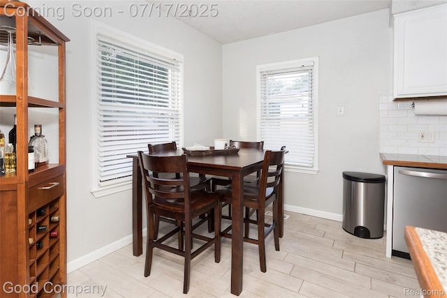 2404 Rowland Ave, Royal Oak, MI 48067 - dining area featuring baseboards and light wood finished floors