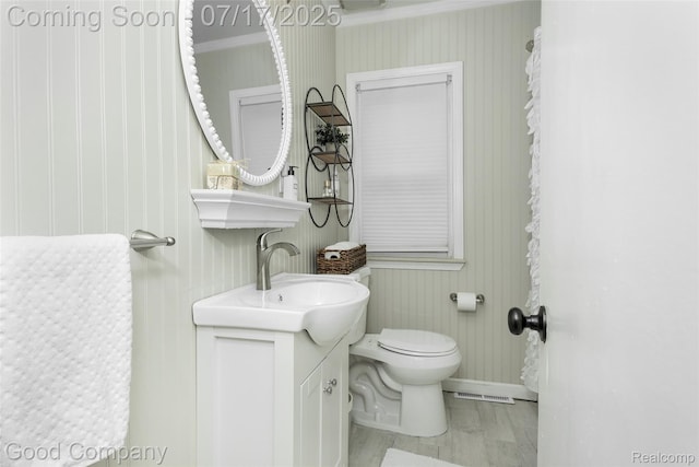2404 Rowland Ave, Royal Oak, MI 48067 - half bathroom featuring crown molding and wallpapered walls