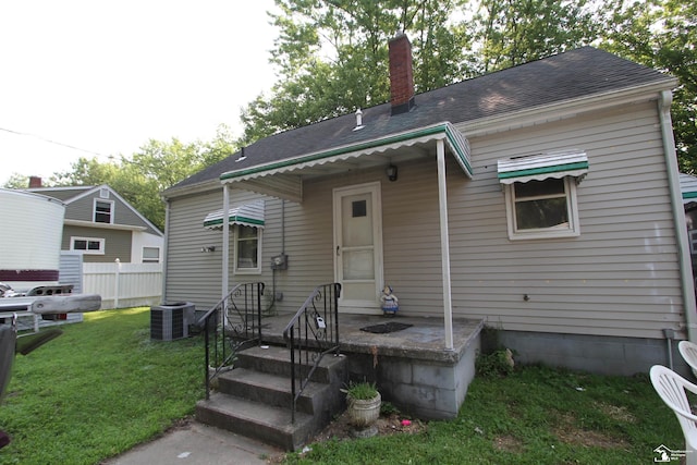15439 Keegan Rd, Monroe, MI 48161 - view of front of property with a shingled roof and a chimney