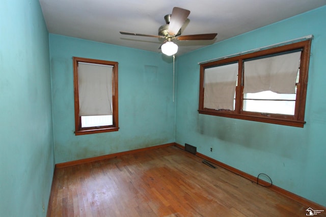 15439 Keegan Rd, Monroe, MI 48161 - spare room with wood finished floors and a ceiling fan