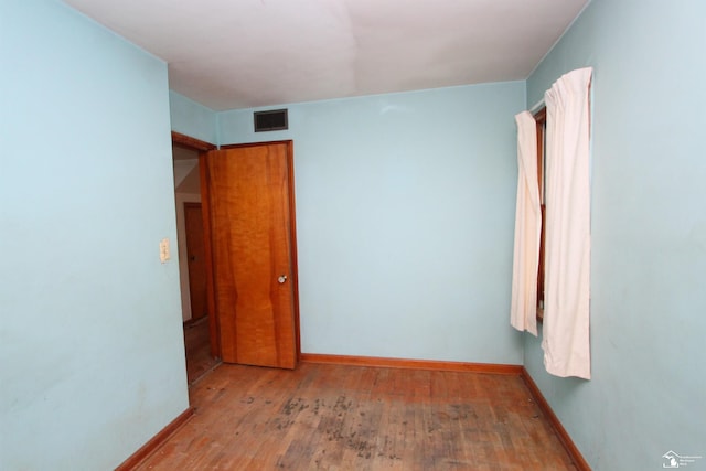 15439 Keegan Rd, Monroe, MI 48161 - unfurnished bedroom featuring baseboards and hardwood / wood-style floors