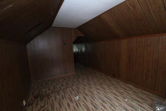 15439 Keegan Rd, Monroe, MI 48161 - additional living space with wood walls, lofted ceiling, and carpet flooring