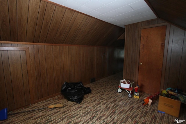 15439 Keegan Rd, Monroe, MI 48161 - bonus room with wood walls, vaulted ceiling, and carpet floors