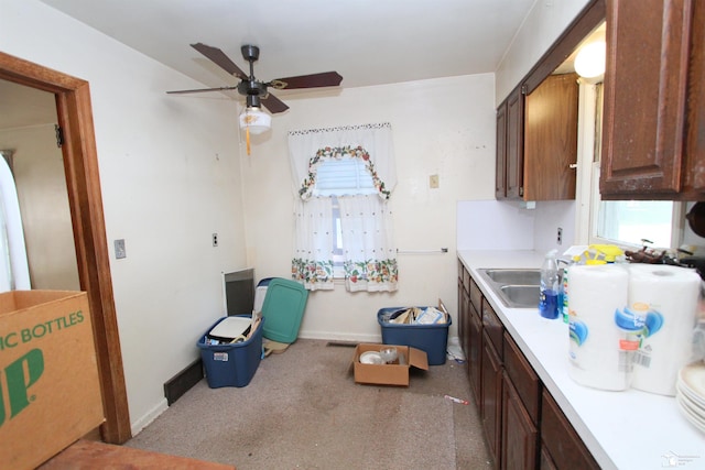 15439 Keegan Rd, Monroe, MI 48161 - kitchen with light countertops, a ceiling fan, and carpet