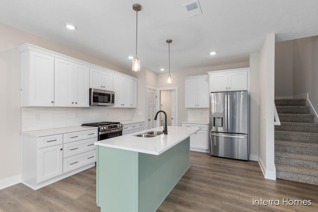 3349 Kings River St SW Unit 36, Wyoming, MI 49418 - kitchen with appliances with stainless steel finishes, white cabinetry, recessed lighting, and tasteful backsplash