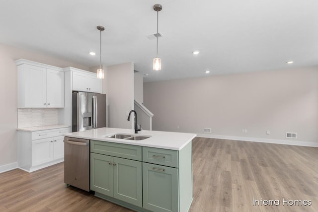 3349 Kings River St SW Unit 36, Wyoming, MI 49418 - kitchen with stainless steel appliances, white cabinets, light wood-style flooring, light countertops, and recessed lighting