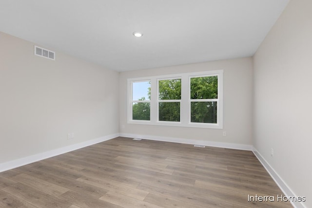 3349 Kings River St SW Unit 36, Wyoming, MI 49418 - empty room featuring wood finished floors and recessed lighting