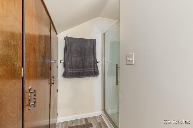 45 Murray St SW, Grand Rapids, MI 49548 - full bath with vaulted ceiling, a shower stall, and wood finished floors