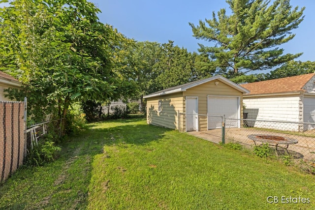 45 Murray St SW, Grand Rapids, MI 49548 - view of yard with a detached garage, an outdoor structure, and driveway