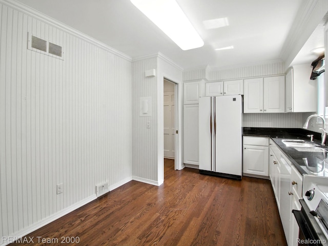 1711 Huntingwood Ln, Bloomfield Hills, MI 48304 - kitchen with dark countertops, white appliances, dark wood-style flooring, white cabinets, and crown molding