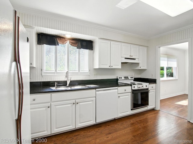 1711 Huntingwood Ln, Bloomfield Hills, MI 48304 - kitchen with white appliances, ornamental molding, dark countertops, dark wood-type flooring, and white cabinets