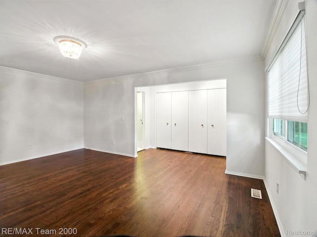 1711 Huntingwood Ln, Bloomfield Hills, MI 48304 - unfurnished bedroom with wood finished floors, a closet, and ornamental molding