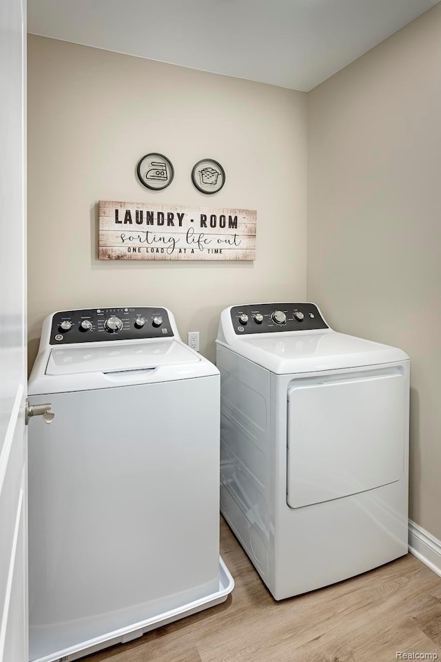 809 Cortland Ln, Troy, MI 48085 - laundry room with separate washer and dryer and light wood-style flooring