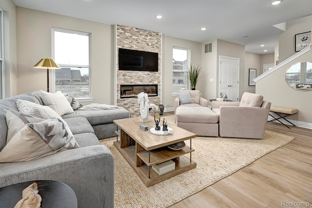 809 Cortland Ln, Troy, MI 48085 - living room with wood finished floors, recessed lighting, and a fireplace
