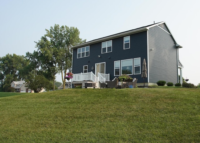 8440 Irish Mist, Onsted, MI 49265 - rear view of property featuring a wooden deck and a lawn