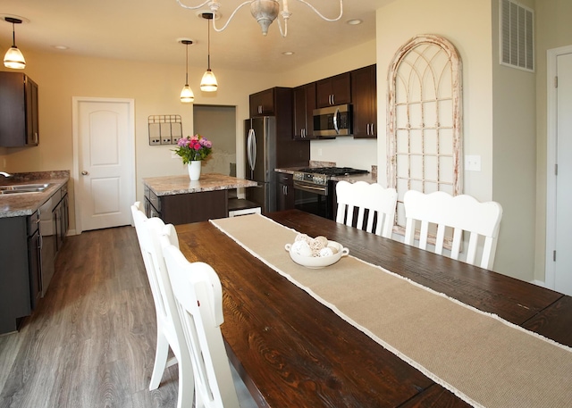 8440 Irish Mist, Onsted, MI 49265 - dining space with dark wood-type flooring