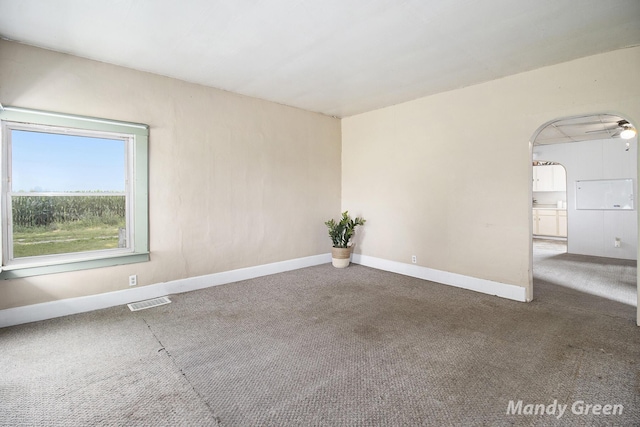 4651 E Pierce Rd, Ithaca, MI 48847 - carpeted spare room featuring arched walkways and baseboards